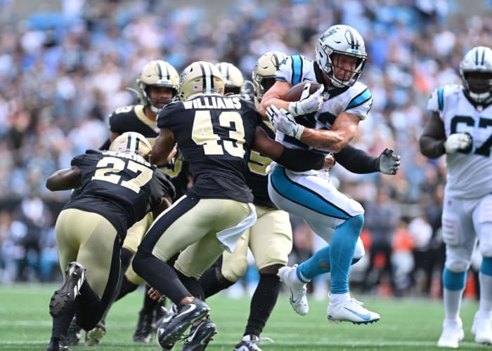 Carolina Panthers running back Christian McCaffrey (22) runs as New Orleans Saints safeties Malcolm Jenkins (27) and Marcus Williams (43) defend. Mandatory Credit: Bob Donnan-USA TODAY